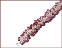 wholesale bracelet with red bead forming flower pattern